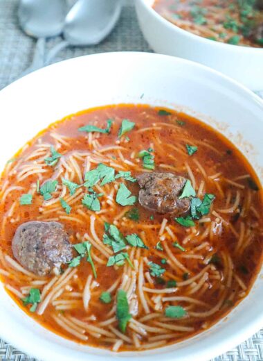 A bowl of Meatball Vermicelli Soup with parsley on top