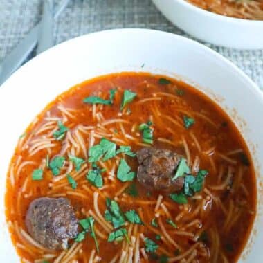 A bowl of Meatball Vermicelli Soup with parsley on top