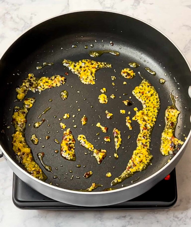 minced garlic and chili flakes in a large skillet