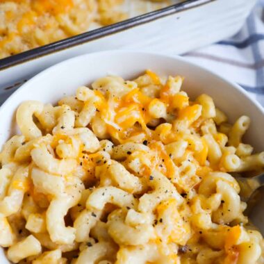 A bowl of mac and cheese and a baked dish