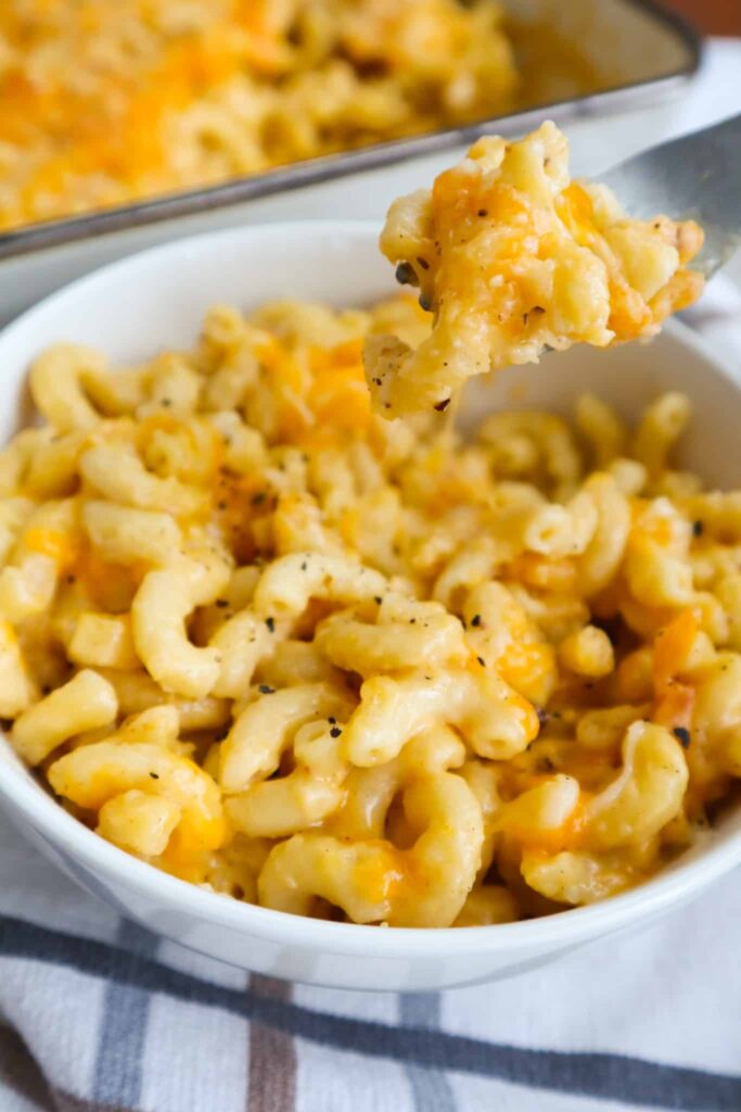 A bowl of mac and cheese with fork