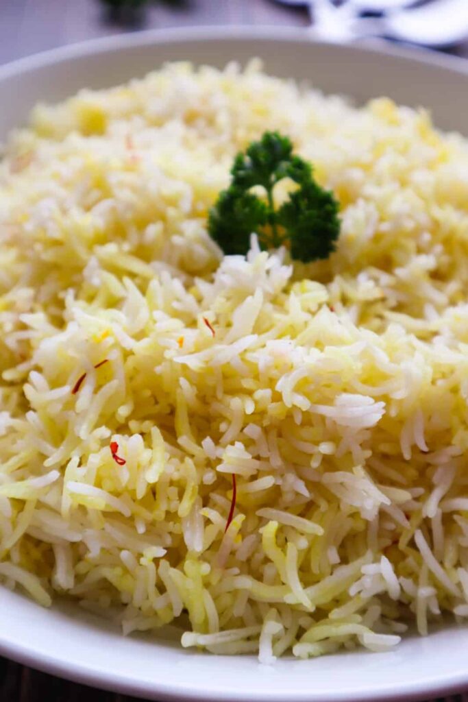 Biryani rice in a dish with cilantro on top