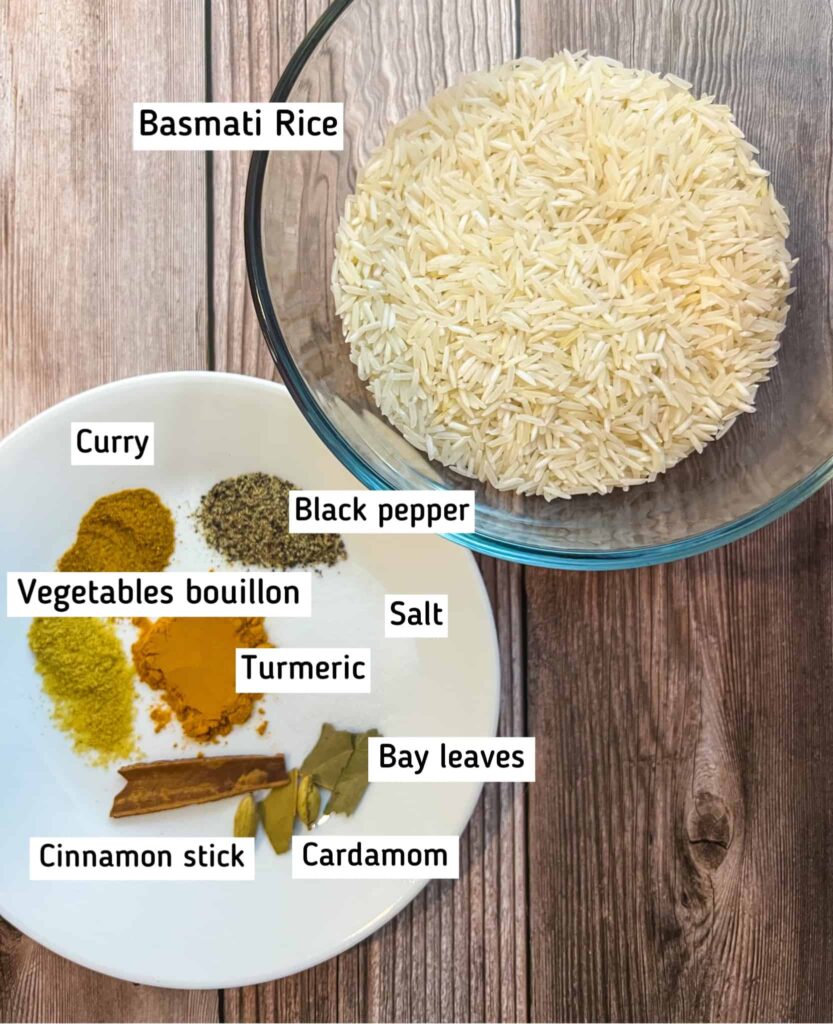 A bowl of raw basmati rice and a plate of the spices