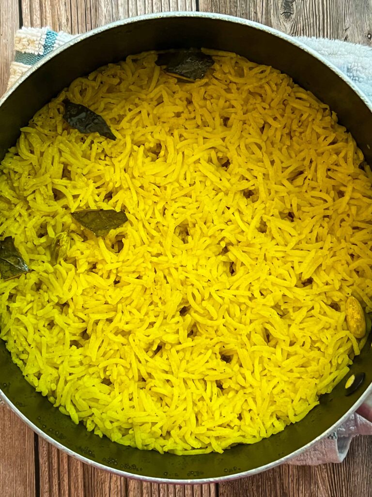 A cooked yellow basmati rice in a pot