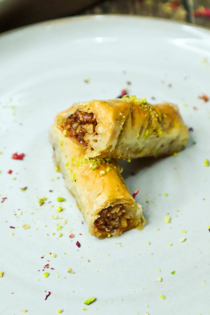 Two pieces of baklava  fingers on a plate