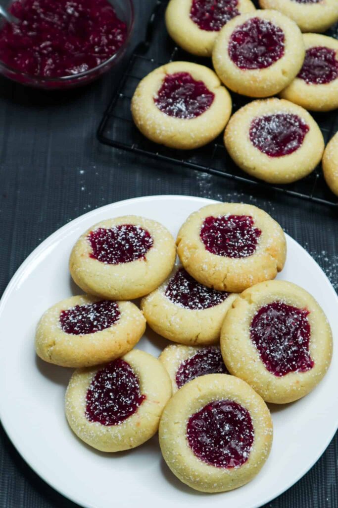 A thumbprint cookies on a wire rack